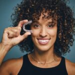 adult woman with clear aligner braces Invisalign