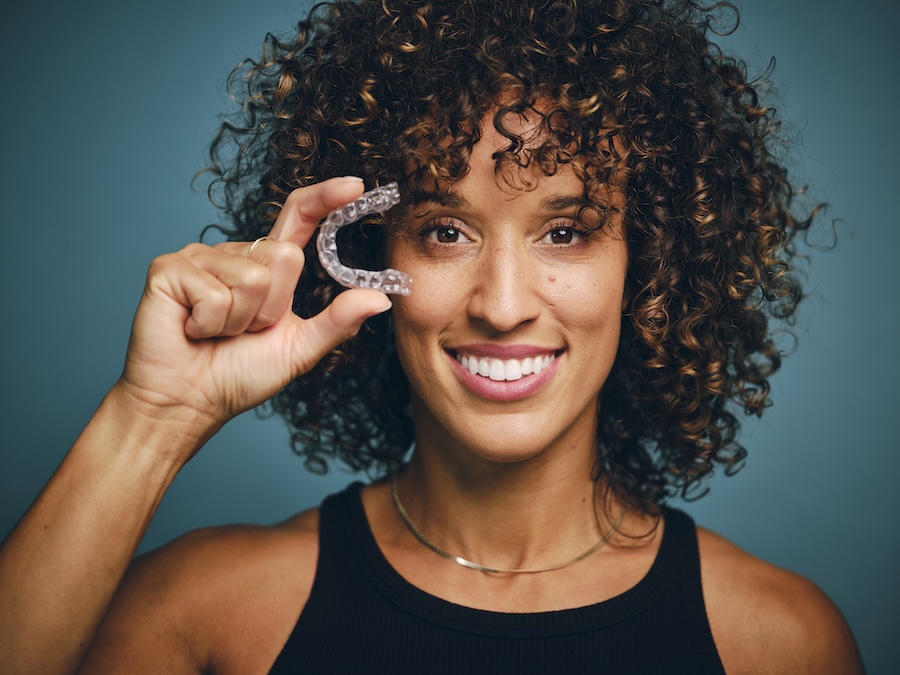 adult woman with clear aligner braces Invisalign
